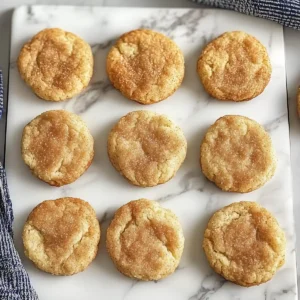 Gluten-free snickerdoodle cookies on a cooling rack.